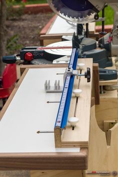 tools are lined up on the table to be used for woodworking and construction projects