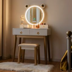 a bedroom with a vanity, stool and round mirror on it's side wall