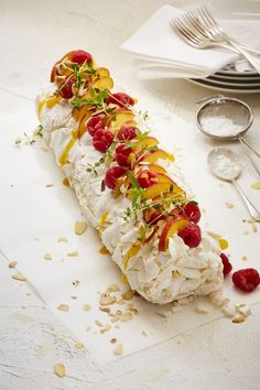 there is a long pastry with fruit on it