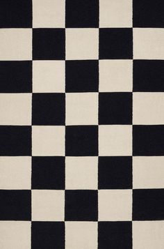 a black and white checkered rug is shown