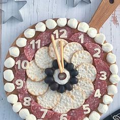 a clock made out of crackers and cheese