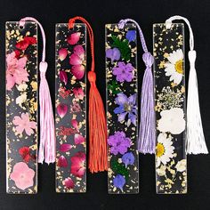 PRICES MAY VARY. 💮Meet your needs💮 You will get 4 styles of dried flower bookmarks, each style has different colors and kinds of flowers, and each bookmark has a tassel pendant of the same color; the rich quantity can meet your diverse needs, You can share with your friends and family 💮Suitable size💮 Each resin flower bookmark measures approx. 1 x 5.5 inch, proper size for you to use, lightweight and easy to store and carry 💮High-quality material💮 These dried flower bookmark are made of hi Dried Flower Bookmarks, Kinds Of Flowers, Flower Bookmarks, Page Markers, Tassel Bookmark, Flower Bookmark, Transparent Resin, Book Marks, Page Marker