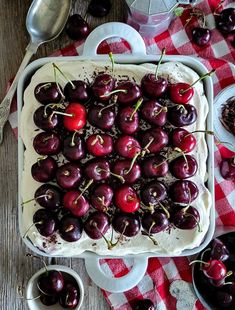 A layered Black Forest Tiramisu is covered with fresh cherries with their stems on.  The dish is sitting on a red checkered cloth with fresh cherries surrounding it. Cake Portions, Bojon Gourmet, Flakey Salt, Olive Salad, Watermelon Cake, Chocolate Sponge Cake, Coffee Granules, Cherry Season, Sponge Cake Recipes