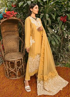 Simple Pakistani Party Dresses Embroidered Salwar Kameez is a charismatic masterpiece to have a head-turning appearance on the big day. This perfectly stitched Kameez Trouser is in lavish cotton fabric and is emblazoned with lavish designs and floral details. Kameez: The beautiful kameez in an alluring mustard shade comes in premium cotton fabric. The stunning cotton kameez is emblazoned with graceful embroidery work. Lavish designs and floral details give a perfect finishing to this mustard-hue Festive Cambric Lawn Suit With Intricate Embroidery, Unstitched Chikankari Embroidery Dress For Eid, Eid Sharara With Intricate Embroidery In Cambric, Eid Dresses With Chikankari Embroidery, Semi-stitched, Chanderi Dress With Chikankari Embroidery For Eid, Eid Dresses With Zari Work In Cambric, Diwali Cambric Dresses With Zari Work, Eid Festival Cambric Dress With Zari Work, Eid Cambric Dresses With Zari Work