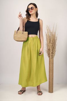 Apple Green Pleated Maxi skirt for women skirt, Long skirt, Custom made, Made to order, Plus size -Model height: 5'5" wearing size S -Length: 33" -Fit: A-line -Closure: Front button and zipper Flowy High-waisted Green Maxi Skirt, Green Cotton Maxi Skirt, Green Full Skirt For Summer, Green Wide-leg Lined Maxi Skirt, Green Wide Leg Lined Maxi Skirt, Green High Waist Flowy Skirt, Green High Waist Skirt, High Waist Green Cotton Skirt, Casual Green Relaxed Wrap Skirt