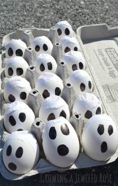 an egg carton filled with lots of white eggs covered in black polka dot dots