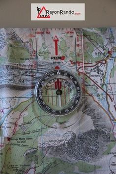 a map with a compass on top of it