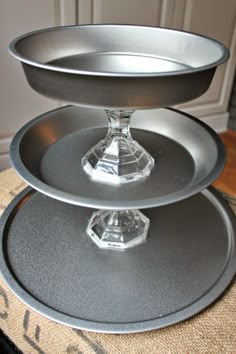 three tiered cake pans sitting on top of each other