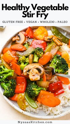 a white plate topped with rice and veggies