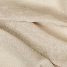 a close up view of a beige fabric