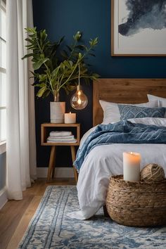 a bedroom with blue walls, white bedding and a basket on the floor next to it