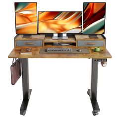 two computer monitors sitting on top of a wooden desk next to each other with metal legs