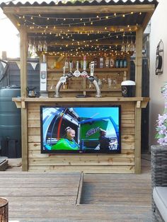 an outdoor bar with a television on it