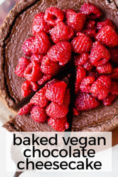 a chocolate cake with raspberries on top and the words baked vegan chocolate cheesecake