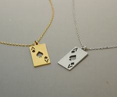 "This necklace features a delicate Ace of Spade charm plated in either gold or silver. The necklace is perfect for those who want to add a touch of uniqueness to their everyday wear. The material used in this necklace is non-tarnish, so you don't have to worry about the metal losing its shine over time. The necklace would make a great gift for anyone who loves playing cards, or unique jewelry. The combination of the unique design of the Ace of Spade and the shiny gold or silver plating creates a Ace Necklace, Spade Necklace, Womens Silver Jewelry, Card Necklace, Ace Of Spades, Personalized Notes, Playing Card, Gold Jewelry Fashion, Metal Necklaces