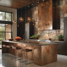 a modern kitchen with an island and bar stools in the center, surrounded by large windows