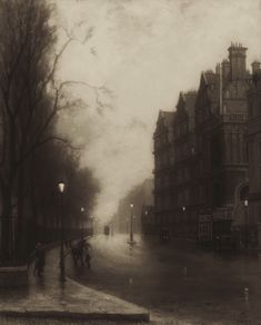 an old photo of people walking down the street on a rainy day with buildings in the background