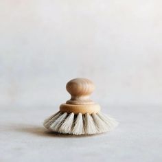 a small white brush sitting on top of a table