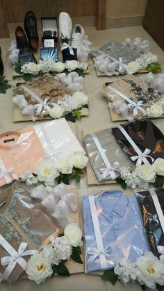 there are many items laid out on the table to be used as gifts for someone's special occasion