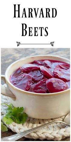 a white bowl filled with beets on top of a table