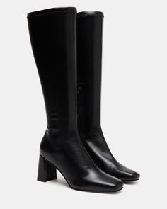 A half-zipper closure gives the HOLLY knee boot a calf-defining fit while an angled block heel and a square toe giving this style a sharp finish. Square toe block heel knee boot Side half zipper closure Angled block heel 2.75 inch heel height Size 6 measurements: 12 inch shaft circumference, 14.25 inch shaft height Size 8 measurements: 14.5 inch shaft circumference, 15.5 inch shaft circumference Size 10 measurements: 15 inch shaft circumference, 16 inch shaft height Vegan leather upper material Kitten Heel Slingbacks, Steve Madden Store, Wedge Loafers, Steve Madden Boots, Black Knee High Boots, Holly Black, Exclusive Shoes, Leather Socks, Knee Boot