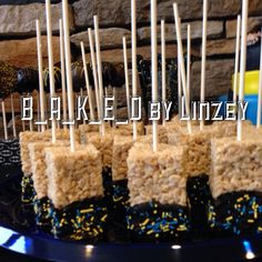 there are some rice krispy treats with toothpicks in them on the plate