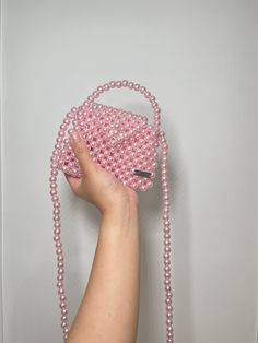 Elevate your outfit with Handmade Candy Pink Pearl beaded bag. Perfect for casual day and add to your pink collection. Bags are 100% handmade. Bags are made to order. We give effort and love of making our bags. Bags are on limited stocks. DM us to order more pieces.  This model can fits 👛: Mini perfume Compact mirror Airpods And other miniature products. Materials: Acrylic pearl beads 10mm Measurements: Height 10cm Length 13 cm  Depth 4cm Pearl strap (113mm) Pink Beaded Bag For Everyday Use, Everyday Pink Beaded Bag, Pink Pouch Bag With Pearl Handle, Trendy Pink Bag With Pearl Handle, Pink Rectangular Shoulder Bag With Pearl Handle, Pink Beaded Shoulder Bag, Handmade Pink Crossbody Bag, Small Pink Shoulder Bag, Small Pink Elegant Bag