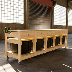 a wooden table with four bins on it