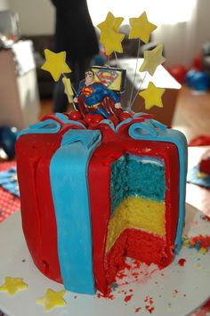 there is a cake that looks like it has been made to look like superman's chest