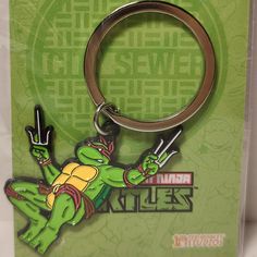 the teenage mutant ninja keychain is on display