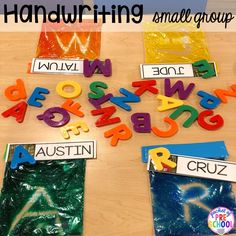 colorful plastic letters and numbers on a table with the words handwritten in small group