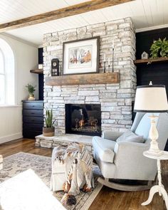 a living room filled with furniture and a fire place