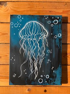 a painting of a jellyfish on a wooden wall