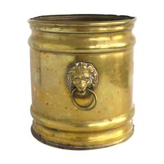 a golden metal container with a lion head on it