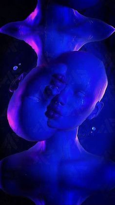 a woman's face is lit up with blue light