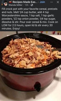 a crock pot filled with cheetos sitting on top of a stovetop