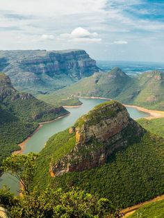 a scenic view of the blue mountains and river from high up in the mountain range