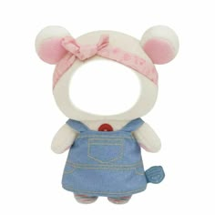 a stuffed animal with a pink bow on it's head and blue overalls