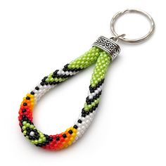 a keychain made out of beads with a metal ring hanging from it's end