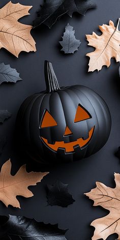 a pumpkin surrounded by leaves on a black background