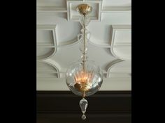 a chandelier hanging from the ceiling in a room