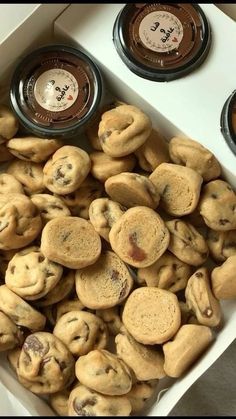 two trays filled with cookies sitting on top of a white counter next to each other