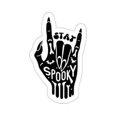 a black and white sticker with the word spooky on it's left hand