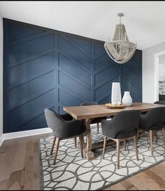 a dining room table with chairs and a chandelier