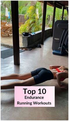 a woman is doing an exercise on the floor with her legs spread out in front of her