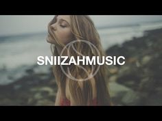 a girl with long hair standing in front of the ocean and text that reads,'snizahmusic '