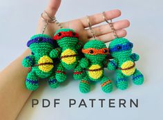 three crocheted teenage mutant keychains are being held by someone's hand