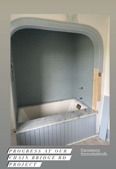 an empty bathtub in the middle of a room