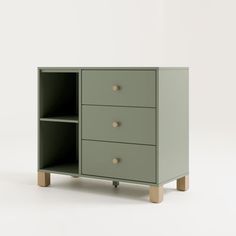 a green cabinet with three drawers on one side and two wooden legs in the other