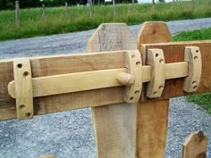 a close up of a wooden gate with two handles